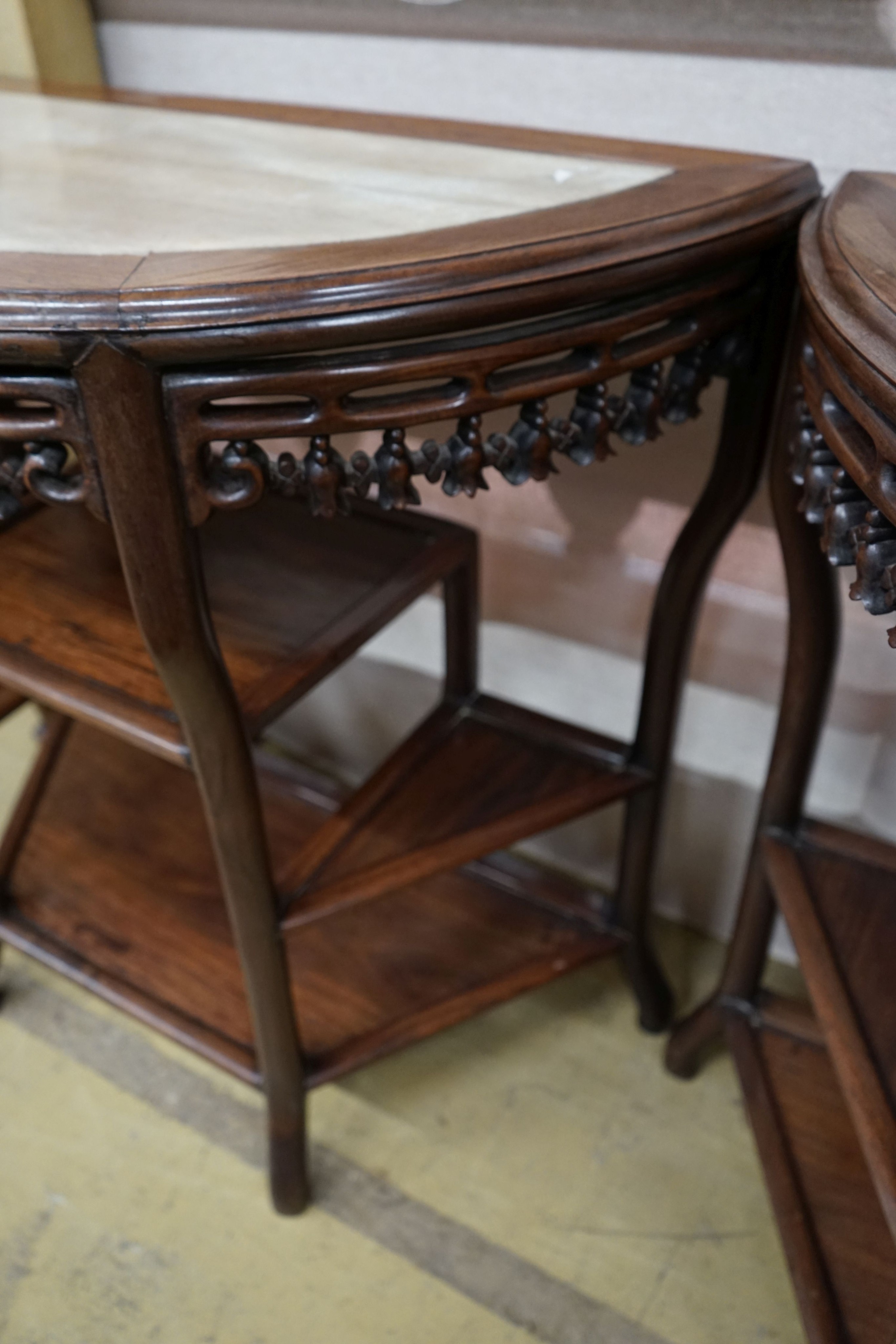 A pair of Chinese marble-topped demi lune console tables, width 82cm, depth 40cm, height 80cm